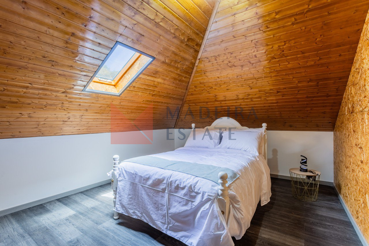 Cozy Bedroom with Double Bed and Skylight in Ribeira Brava Apartment Bedroom with a double bed and skylight in a short-term rental apartment in Ribeira Brava, Madeira, Portugal