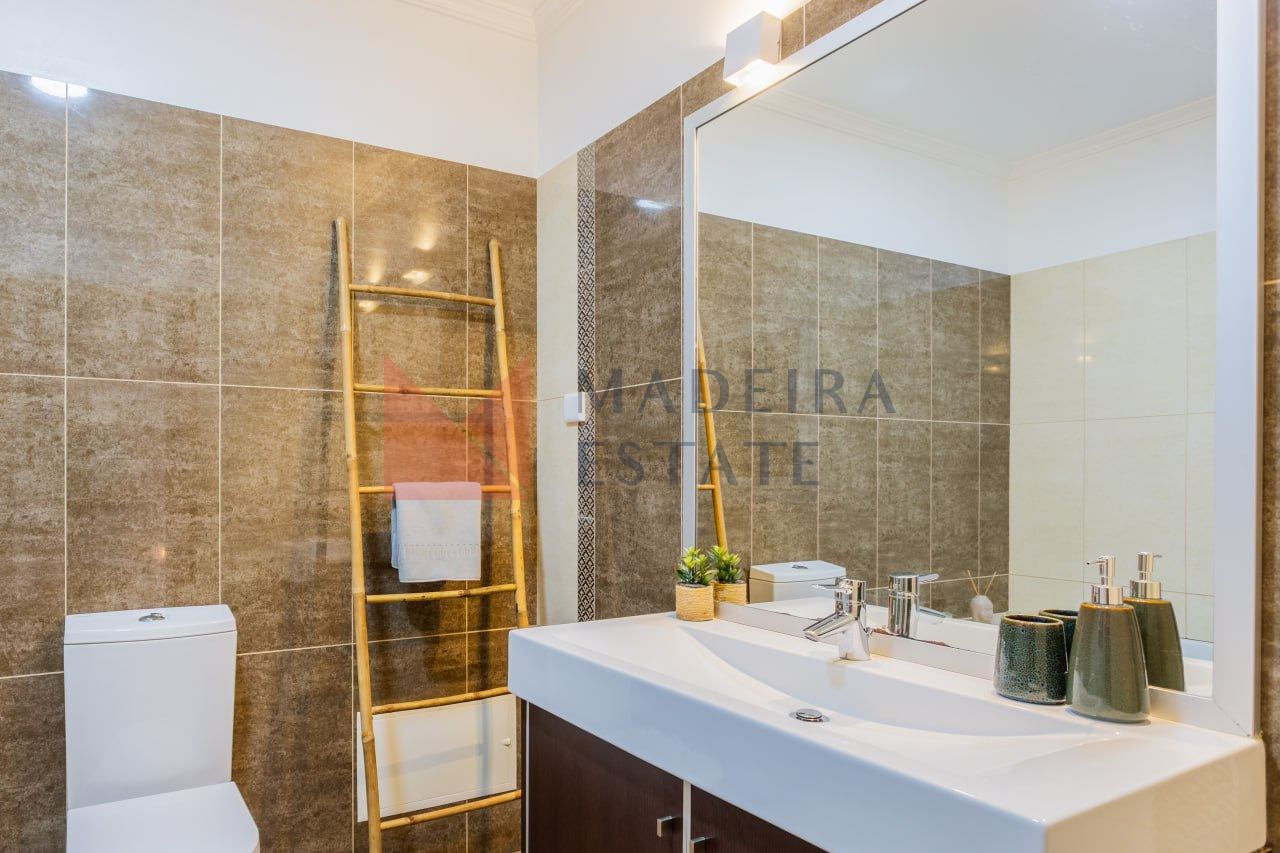 Modern bathroom with brown tones and stylish design in vacation rental home in Madeira