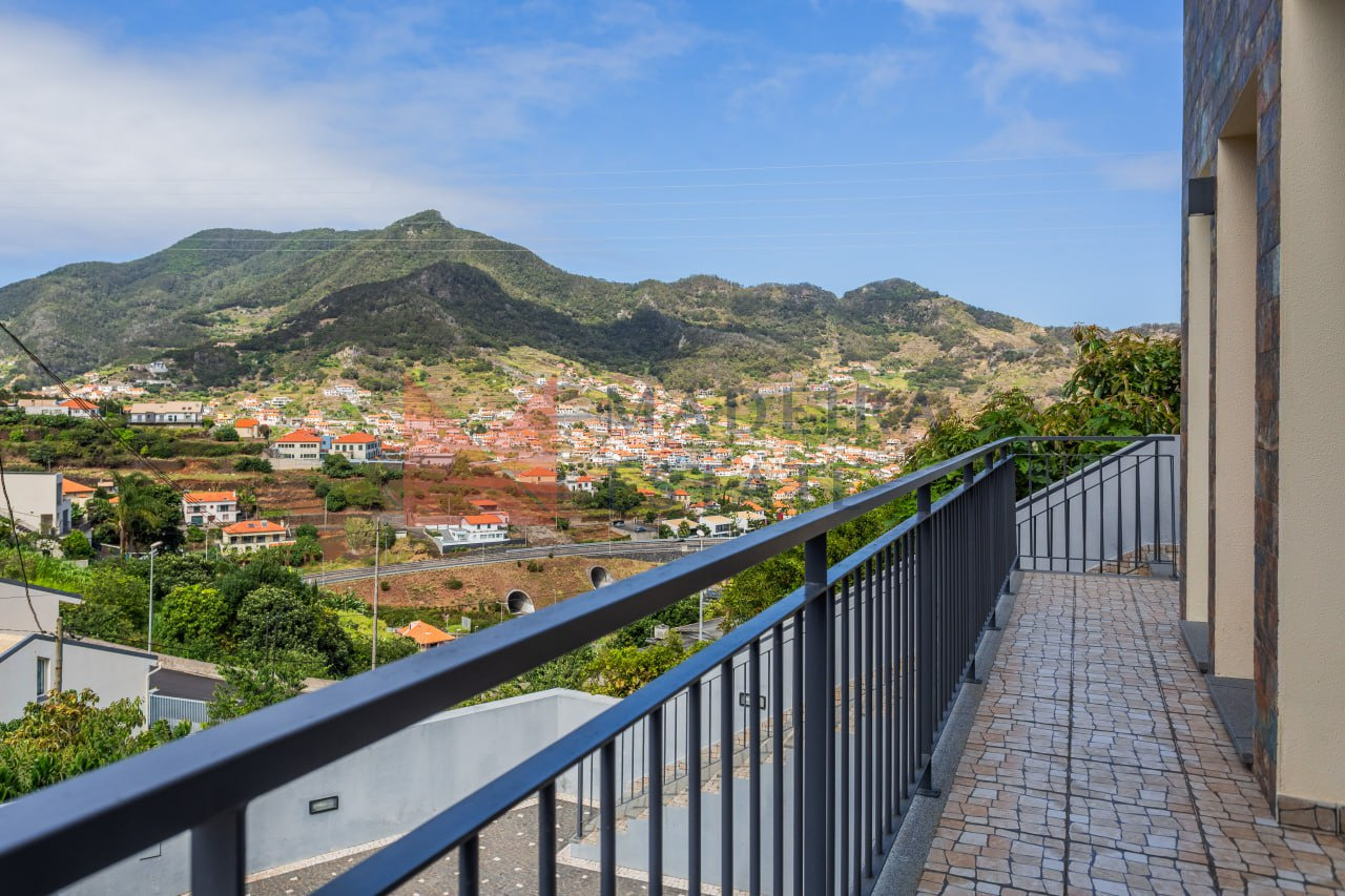 Alternate view from balcony overlooking mountains and the city in Machico, Madeira