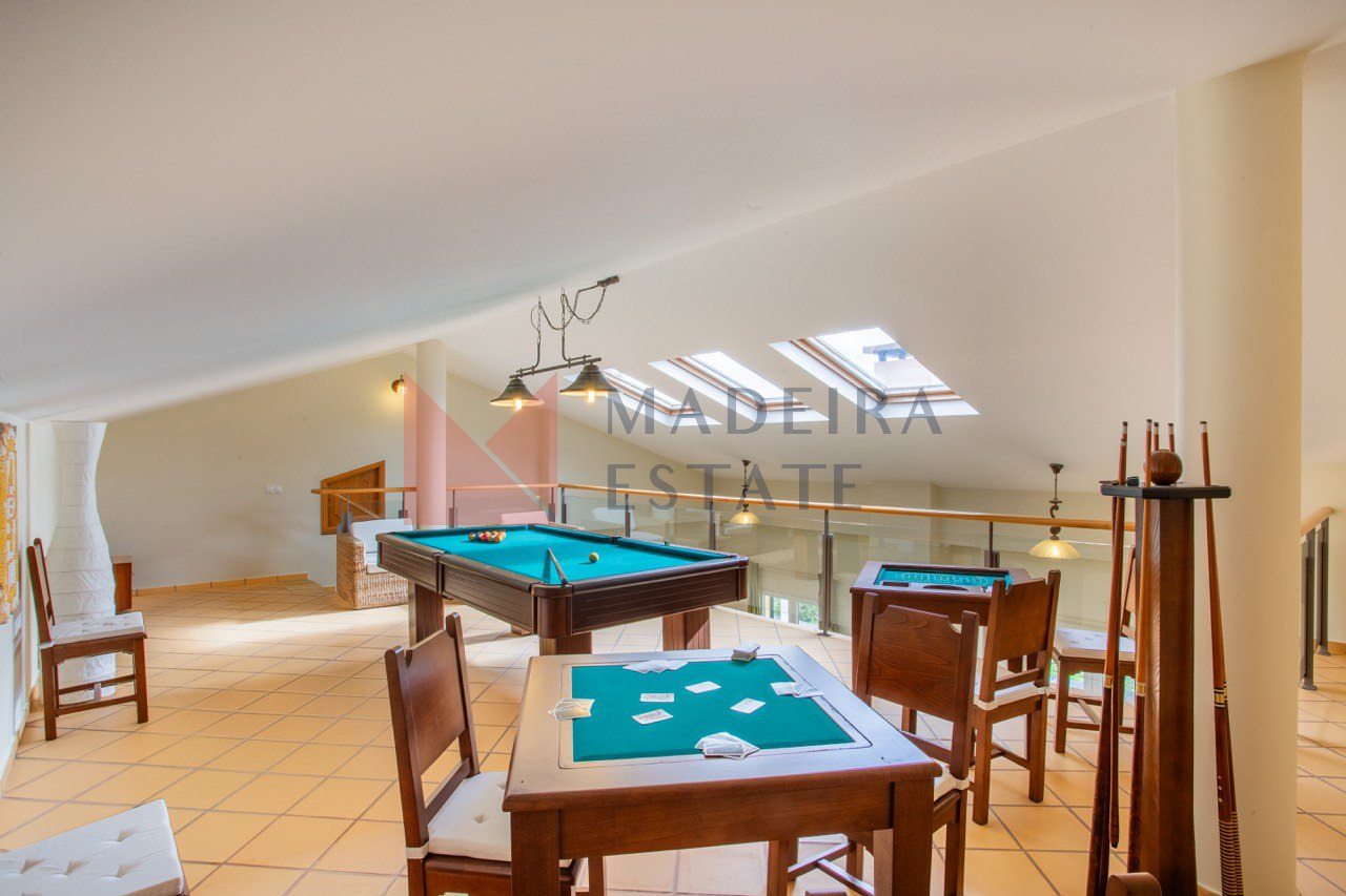 Game room with pool table, card table, and roulette in a luxury villa for rent in Madeira