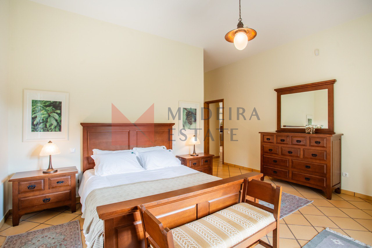 Cozy bedroom with a double bed in a luxury villa for rent in Madeira