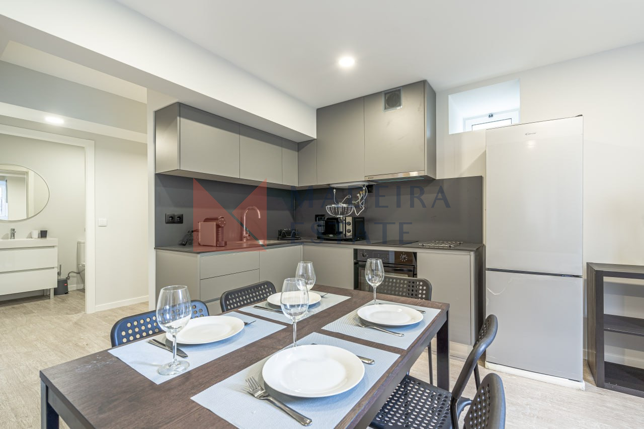 Modern kitchen in gray tones at JMF House, São Vicente, Madeira