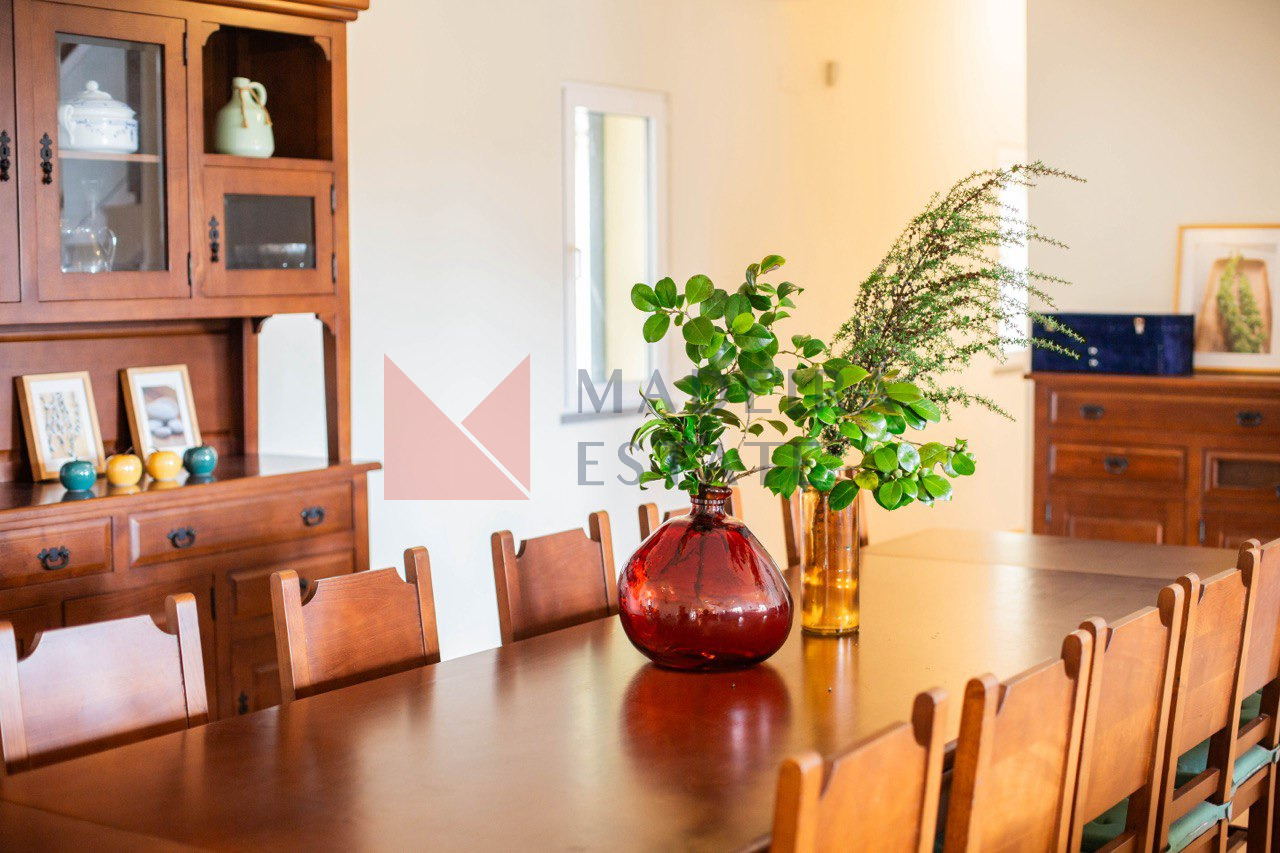 Spacious living room with a dining table for 10 people in a luxury villa for rent in Madeira