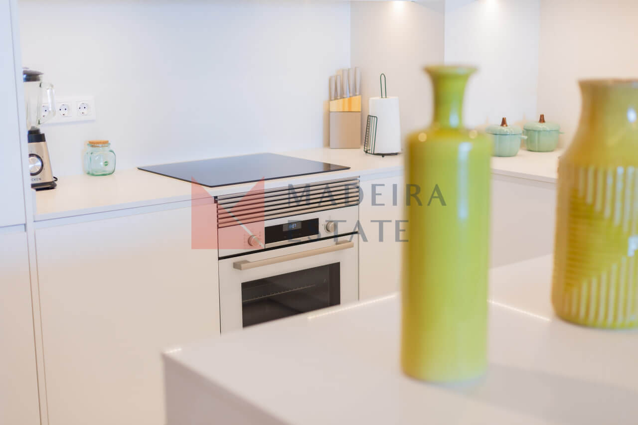 Bright modern kitchen in a Funchal short-term rental apartment