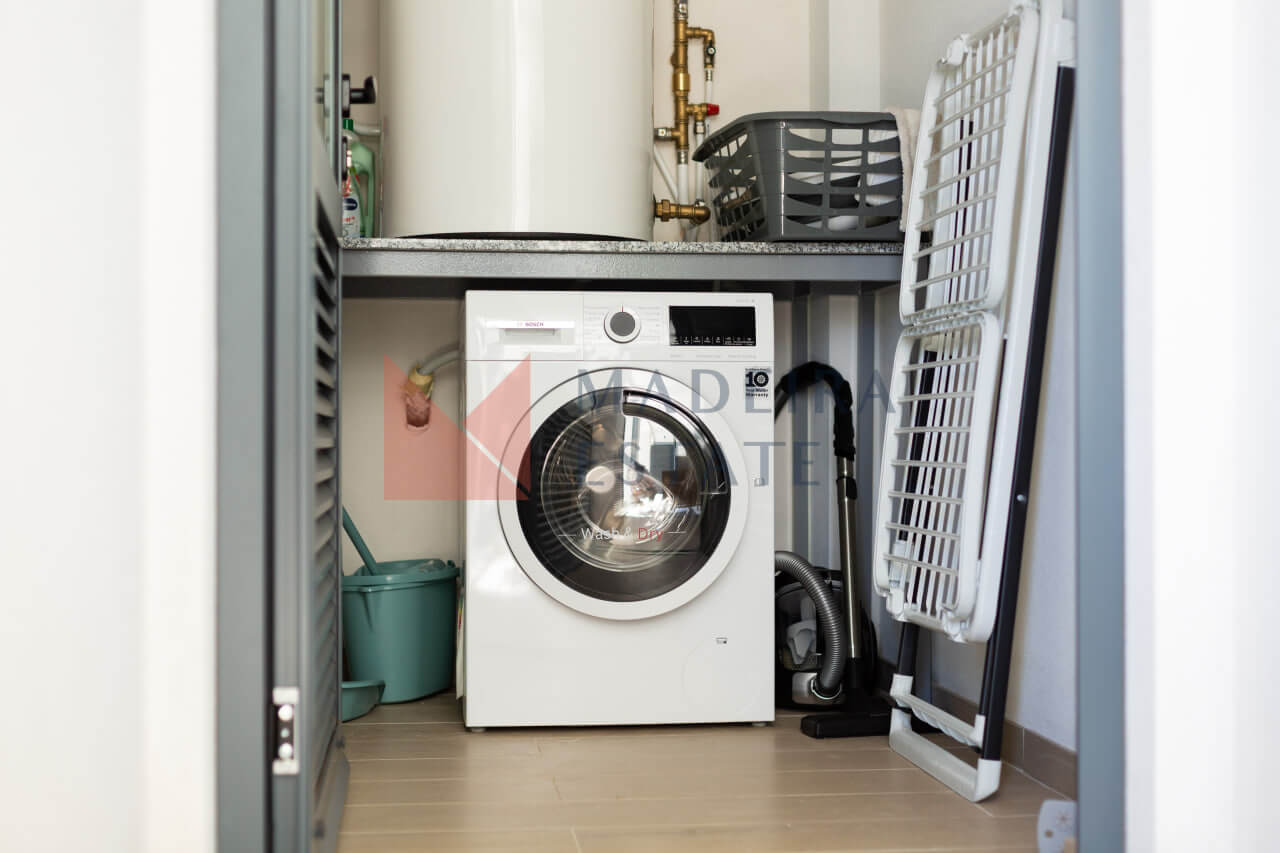 Washing machine in short-term rental apartment in Funchal