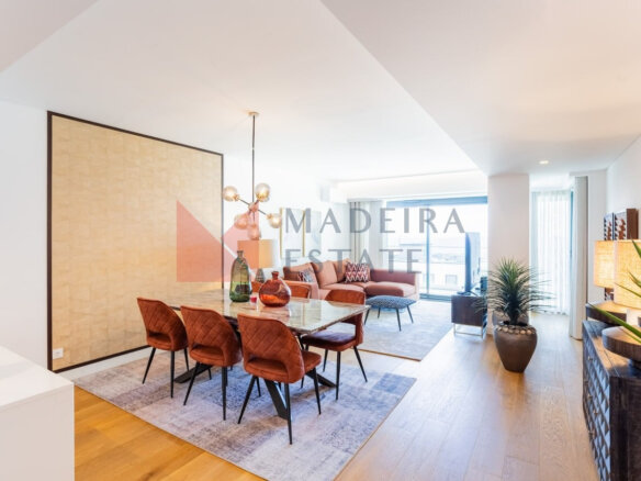 Modern short-term rental living room with panoramic windows and ocean view in Funchal
